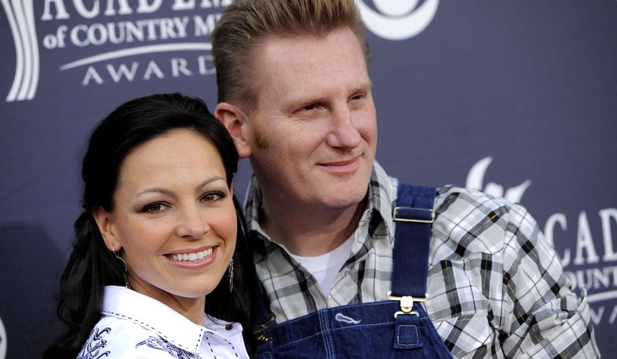 FILE - In this April 3, 2011 file photo, Joey Martin Feek, left, and Rory Lee Feek of "Joey + Rory" arrive at the 46th Annual Academy of Country Music Awards in Las Vegas, Nev. Joey Feek is recovering after undergoing surgery to treat a reoccurrence of cervical cancer. The singer underwent surgery on Thursday, July 9, 2015, at the Cancer Treatment Centers of America in Chicago and said she was doing “great.”(AP Photo/Chris Pizzello, File)
