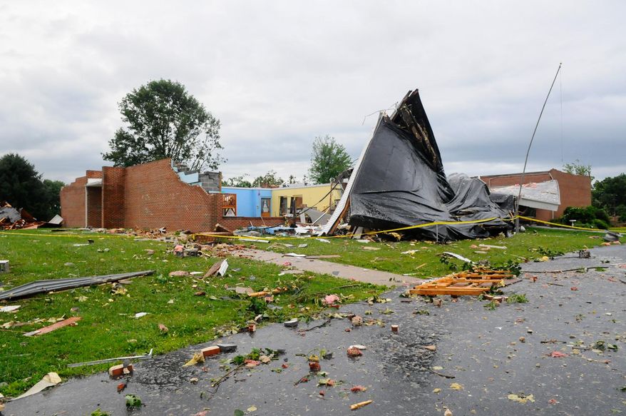 Debris is scattered around the Blue Mountain Seventh-Day Adventist Elementary School after a severe storm rolled through the area in Tilden Township, Pa. in Berks County on Thursday, July 9, 2015. (Jacqueline Dormer/The Republican-Herald via AP) MANDATORY CREDIT
