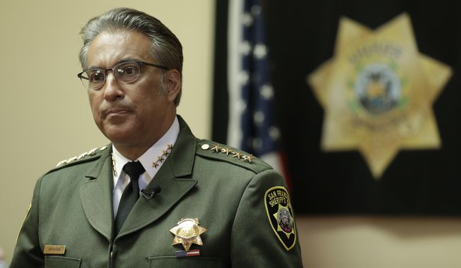 FILE - In this Monday, July 6, 2015, file photo, San Francisco Sheriff Ross Mirkarimi fields questions during an interview in San Francisco. Mirkarimi was already fighting for his political life. Then his jail released a Mexican national wanted by federal immigration authorities who wanted to deport the man for the sixth time. The jail’s decision to release Juan Francisco Lopez-Sanchez,  who is charged with randomly shooting to death a young San Francisco woman shortly after his release, has placed Mirkarimi squarely in the center of a national debate over immigration. (AP Photo/Ben Margot, File)