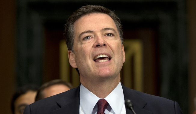 In this July 8, 2015, photo, FBI Director James Comey testifies during the Senate Judiciary Committee hearing on Capitol Hill in Washington. Comey says Dylann Roof, the gunman in the Charleston church massacre should not have been allowed to purchase the gun used in the attack, and on July 10 attributed the problem to incomplete and inaccurate paperwork related to an arrest of Roof weeks before the shooting.  (AP Photo/Carolyn Kaster)