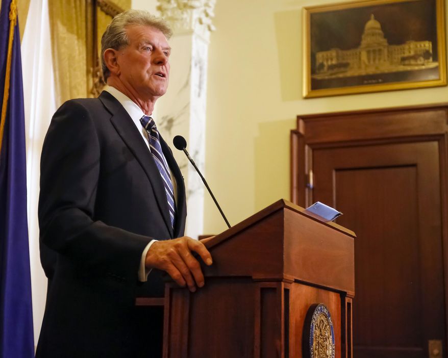 FILE - In this April 29, 2015 file photo, Idaho Gov. C.L. "Butch" Otter issues a proclamation ordering a special session of the state legislature at the state Capitol building in Boise, Idaho. Otter knew for months that the federal government was withholding funding for the state's school broadband program, but kept the information from lawmakers, public records obtained by The Associated Press show. (AP Photo/Otto Kitsinger, File)
