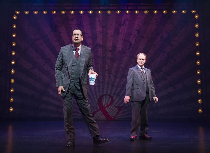 In this image released by Boneau/Bryan-Brown, Penn Jillette, left, and Teller perform in "Penn & Teller On Broadway," a limited engagement through August 16 at the Marquis Theatre in New York. (Joan Marcus/Boneau/Bryan-Brown via AP)
