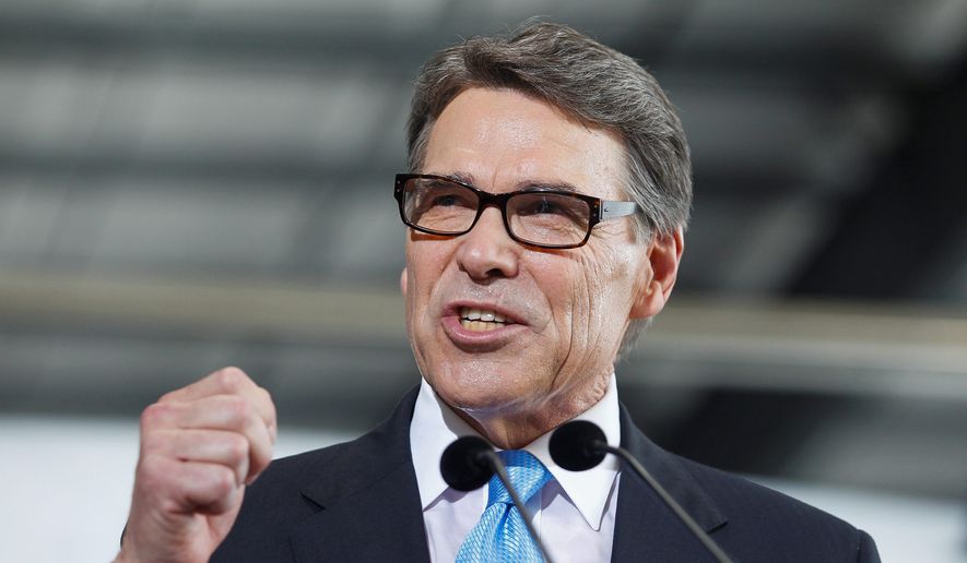 Presidential hopeful Rick Perry called on Donald Trump to end his presidential bid on July 18, 2015. (Associated Press) ** FILE **