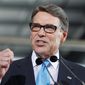 Presidential hopeful Rick Perry called on Donald Trump to end his presidential bid on July 18, 2015. (Associated Press) ** FILE **