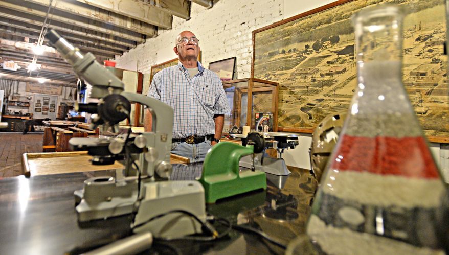 In this 2015 photo, Paul Hoblitzell, president of the Oil & Ga Museum, looks over the acrylonitrile butadiene styrene (ABS) plastic display in the new exhibit section at the museum in Parkersburg, W.Va. (Tom Hindman/The Daily Mail via AP) MANDATORY CREDIT