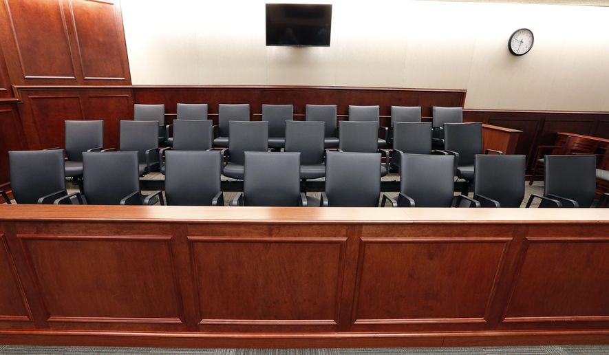 This Jan. 15, 2015 file photo, shows a view of the jury box inside a Colorado courtroom. (AP Photo/Brennan Linsley, pool, file) **FILE**