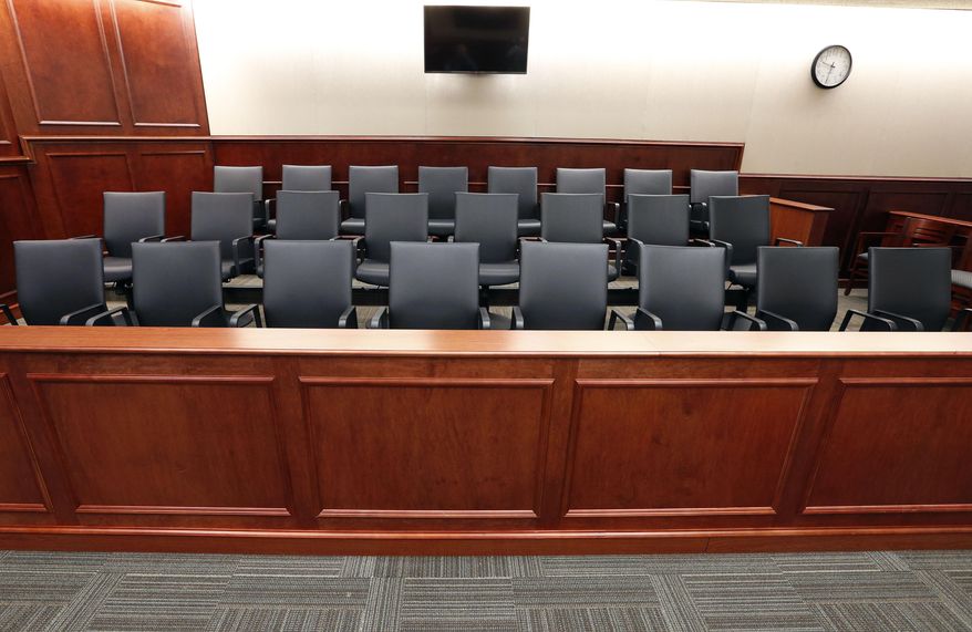 This Jan. 15, 2015 file photo, shows a view of the jury box inside a Colorado courtroom. (AP Photo/Brennan Linsley, pool, file) **FILE**