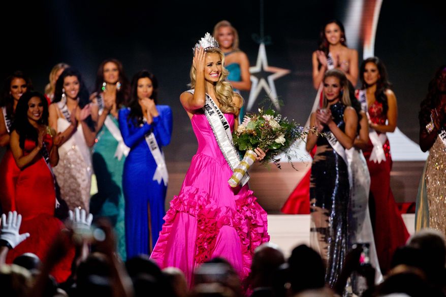 Miss Oklahoma Olivia Jordan celebrates after being named Miss USA during the 2015 Miss USA pageant in Baton Rouge, La., in this Sunday, July 12, 2015, file photo. A federal judge has dismissed a lawsuit by Anita Noelle Greene, a transgender woman who accused the Miss United States of America pageant corporation of discrimination for denying her the right to participate in competitions. (AP Photo/Derick E. Hingle)