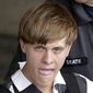 Charleston, S.C., shooting suspect Dylann Storm Roof is escorted from the Cleveland County Courthouse in Shelby, N.C. (AP Photo/Chuck Burton, File)