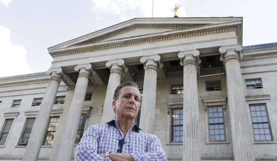 In this June 9, 2015 photo, Joe Ponzi, former chief of the Brooklyn District Attorney Investigators, poses in front of Brooklyn's Borough Hall in New York. In his 36 years on the job, Ponzi oversaw some of the borough’s most famed cases, including the indictment of two sitting state supreme court judges. A famed polygraph expert, Ponzi is credited with gaining the confession of a conspirator who proved key in the prosecutions against the so-called Mafia Cops. (AP Photo/Kathy Willens)