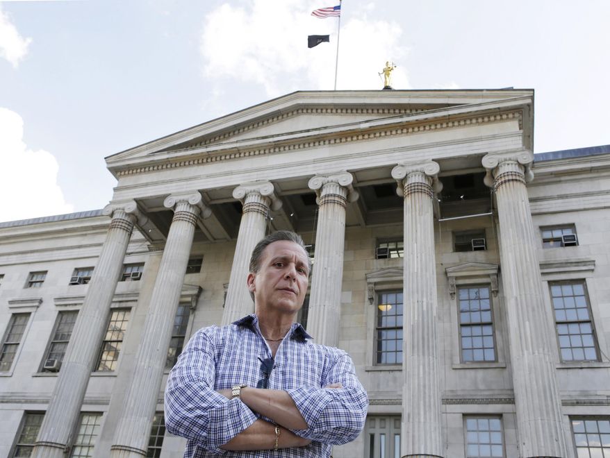 In this June 9, 2015 photo, Joe Ponzi, former chief of the Brooklyn District Attorney Investigators, poses in front of Brooklyn's Borough Hall in New York. In his 36 years on the job, Ponzi oversaw some of the borough’s most famed cases, including the indictment of two sitting state supreme court judges. A famed polygraph expert, Ponzi is credited with gaining the confession of a conspirator who proved key in the prosecutions against the so-called Mafia Cops. (AP Photo/Kathy Willens)