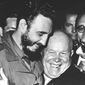 Cuban leader Fidel Castro, left, and Soviet leader Nikita Khrushchev hug at the United Nations in late 1960. (AP Photo/Marty Lederhandler)