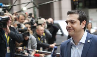 Greek Prime Minister Alexis Tsipras arrives for a meeting of eurozone heads of state at the EU Council building in Brussels on Sunday, July 12, 2015. (AP Photo/Francois Walschaerts)