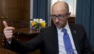 Ukrainian Prime Minister Arseniy Yatsenyuk speaks during an interview with the Associated Press following the first U.S.-Ukraine Business Forum co-hosted by the U.S. Chamber of Commerce and the Commerce Department, Monday, July 13, 2015, in Washington.   (AP Photo/Manuel Balce Ceneta)