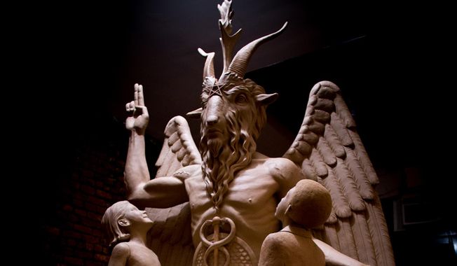 This July 6, 2015 file photo provided by The Satanic Temple shows the sculpture an 8½-foot-tall bronze monument featuring Satan was cast from in New York. A group plans to unveil the 1½-ton Baphomet, which shows Satan with horns, hooves, wings and a beard flanked by two young children, at a private event in Detroit. The Satanic Temple says it advocates the separation of church and state. (The Satanic Temple via AP, File)