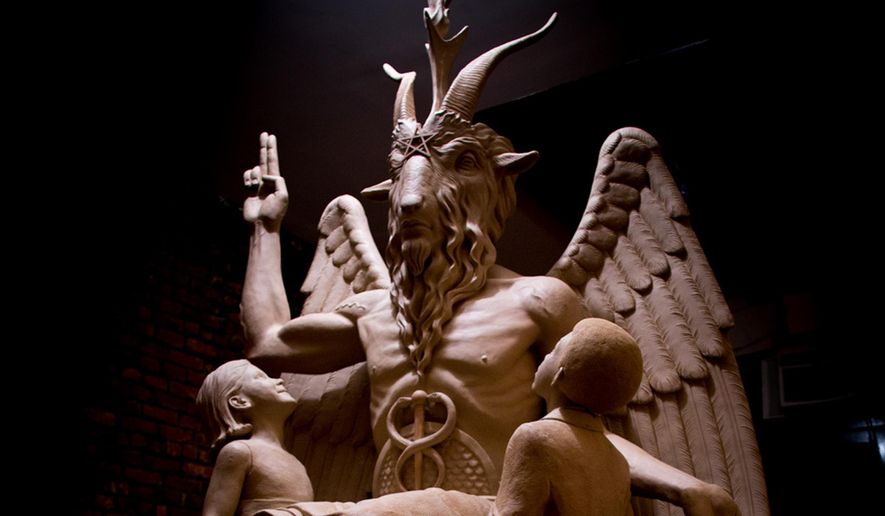 This July 6, 2015 file photo provided by The Satanic Temple shows the sculpture an 8½-foot-tall bronze monument featuring Satan was cast from in New York. A group plans to unveil the 1½-ton Baphomet, which shows Satan with horns, hooves, wings and a beard flanked by two young children, at a private event in Detroit. The Satanic Temple says it advocates the separation of church and state. (The Satanic Temple via AP, File)