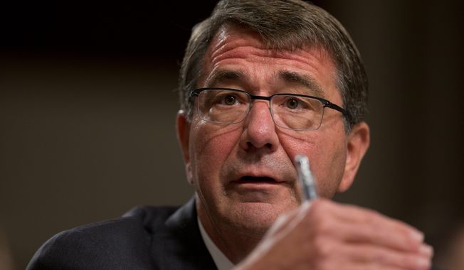 Defense Secretary Ashton Carter ordered a review of base security procedures Friday afternoon, just one day after four Marines were killed by a gunman in Chattanooga, Tenn. (Associated Press)