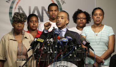 The Rev. Al Sharpton, center, is joined by Eric Garner&#39;s mother Gwen Carr, left, daughter Erica Garner, second from left, son Eric Garner, third from left, daughter Emerald Snipes, second from right, and wife Esaw Snipes, as he speaks during a news conference, Tuesday, July 14, 2015, in New York. The family of Garner, a black man who died after being placed in a white police officer&#39;s chokehold, discussed the $5.9 million settlement it reached with the city days before the anniversary of his death. (AP Photo/Mary Altaffer)
