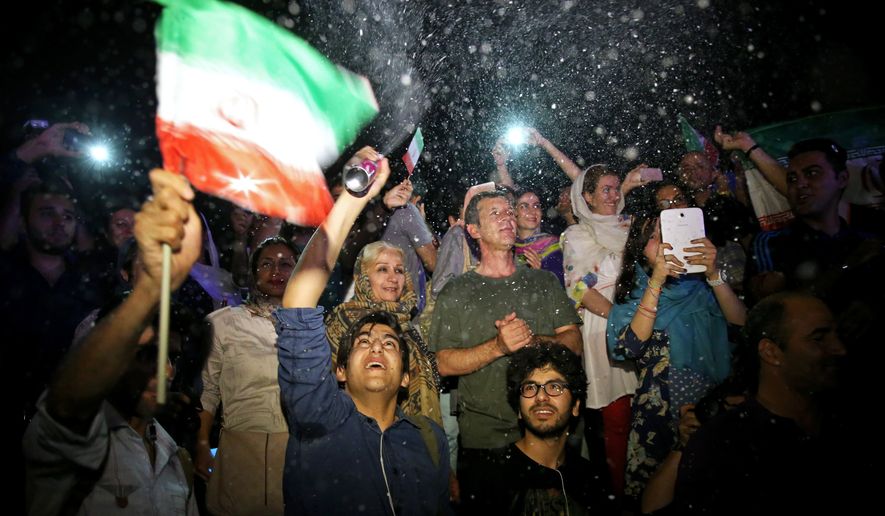 In Tehran, young Iranians danced in streets and motorists honked their horns upon hearing news of the accord. Some people blew South African-style vuvuzela horns like those heard at the World Cup. (Associated Press)