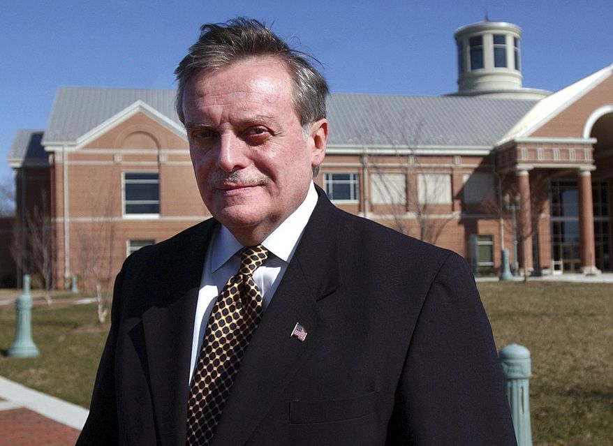 FILE - In this March 15, 2004 file photo, Harrisburg Mayor Stephen R. Reed stands in front of the National Civil War Museum in Harrisburg, Pa. Reed was charged Tuesday, July 14, 2015, with hundreds of counts of corruption after an investigation of city finances during his 28 years in office. (AP Photo/Carolyn Kaster, File)