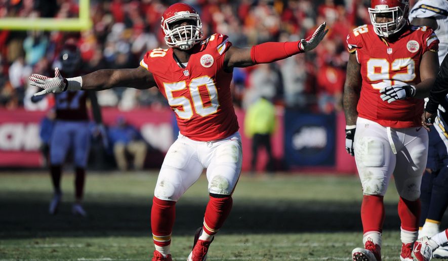 FILE - In this Dec. 28, 2014, file photo, Kansas City Chiefs outside linebacker Justin Houston (50) celebrates a sacking of San Diego Chargers quarterback Philip Rivers with Chiefs nose tackle Dontari Poe (92) looking on during the first half of an NFL football game in Kansas City, Mo. A person familiar with the situation tells The Associated Press that the Chiefs and All-Pro linebacker Justin Houston have agreed to a six-year, $101 million contract that includes $52.5 million in guarantees. The person spoke on condition of anonymity Wednesday, July 15, 2015,  because the deal has not been announced.  (AP Photo/Ed Zurga, File)