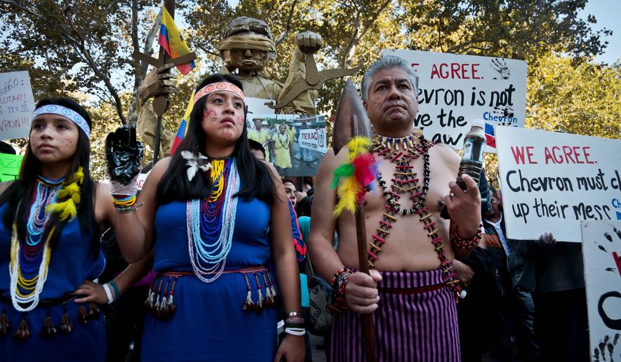 Protesters rallied outside a federal court in 2013 to protest Chevron&#39;s &quot;racketeering lawsuit against the Ecuadorean rainforest villagers,&quot; according to Amazon Watch. The group said the lawsuit was &quot;retaliatory,&quot; but its claims have been found to be dubious. (Associated Press)