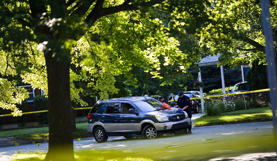 Michigan State Police investigate the scene of a shootout after an early-morning chase in Flint, Mich. on Thursday July 16, 2015.   Authorities say Michigan State Police troopers shot and wounded two men following the early-morning chase.  Police say the wounds weren&#39;t considered life-threatening.  (Christian Randolph/The Flint Journal-MLive.com via AP) LOCAL TELEVISION OUT; LOCAL INTERNET OUT; MANDATORY CREDIT