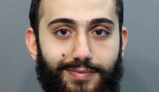 This April 2015 booking photo released by the Hamilton County Sheriffs Office shows a man identified as Mohammad Youssduf Adbulazeer after being detained for a driving offense. A U.S. official speaking on condition of anonymity identified the gunman in shootings at two Chattanooga military facilities as Muhammad Youssef Abdulazeez, who shares the same age and address as the man in the photo. (Hamilton County Sheriffs Office via AP) ** FILE **