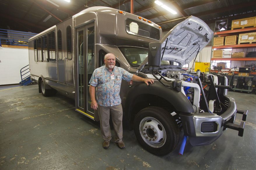 ADVANCE FOR WEEKEND OF JULY 19, 2015. In this July 10, 2015 photo, Stanley Osserman poses for a portrait next to a hydrogen-powered shuttle bus at the Hawaii Center for Advanced Transportation Technologies in Honolulu. Hydrogen-powered vehicles are beginning to roll onto Hawaii&#39;s transportation scene. Two 25-seat hydrogen-powered buses will soon be shuttling tourists between the visitors center and the Thurston Lava Tube at Hawai‘i Volcanoes National Park, and hydrogen might someday fuel the Wiki-Wiki shuttles at Hono­lulu Airport. (Dennis Oda/ The Star-Advertiser via AP)