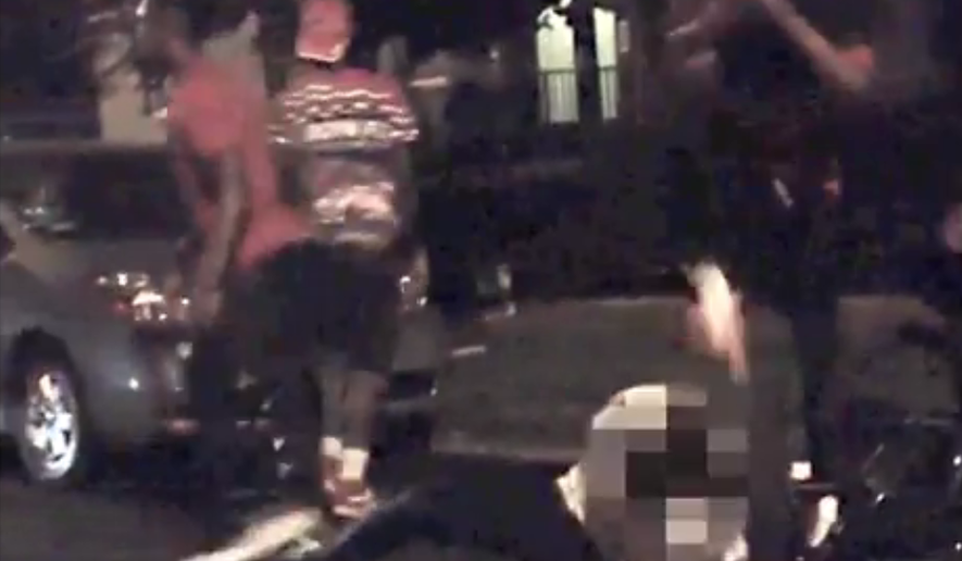 D.C. police released a video of a violent assault in hope of identifying five suspects who beat and stomped a person before stealing two bicycles.