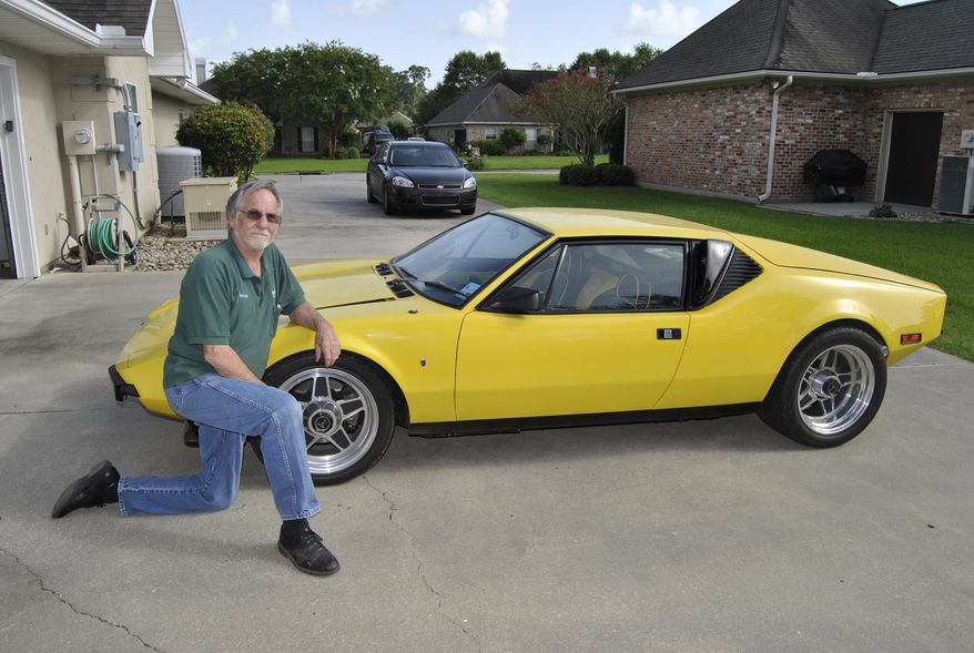 ADVANCE FOR MONDAY, JULY 20 - Sonny Walet of New Iberia, La., shows off his 1972 De Tomaso Pantera on July 8, 2015. After discovering that Walet's car was on the market, Nicolas Quentin from Bordeaux, France, stepped up to express interest. After seeing a real Pantera for the first time when he was around 10 years old, Quentin said the car has been on his mind ever since. (Corey Vaughn/The Daily Iberian via AP)