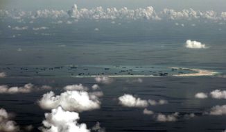 China&#39;s alleged on-going reclamation of Mischief Reef in the Spratly Islands in the South China Sea.  (Ritchie B. Tongo/Pool Photo via AP) **FILE**