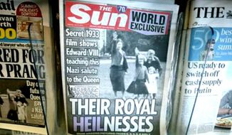 A row of newspapers on display including a paper with a photo of Britain&#39;s Queen Elizabeth as a child giving a Nazi salute, in a shop, in London, Saturday July 18, 2015. Buckingham Palace has expressed its disappointment with a tabloid newspaper for publishing images of a young Queen Elizabeth II performing a Nazi salute together with her family in 1933, the year Adolf Hitler came to power. The palace took the unusual step of commenting on Saturday&#39;s report in The Sun newspaper, which shows the queen — then about 7 years old — at the family home in Balmoral, surrounded by her uncle, mother, and sister. The grainy footage also shows Elizabeth&#39;s mother making the salute. (AP Photo/Tim Ireland) ** FILE **