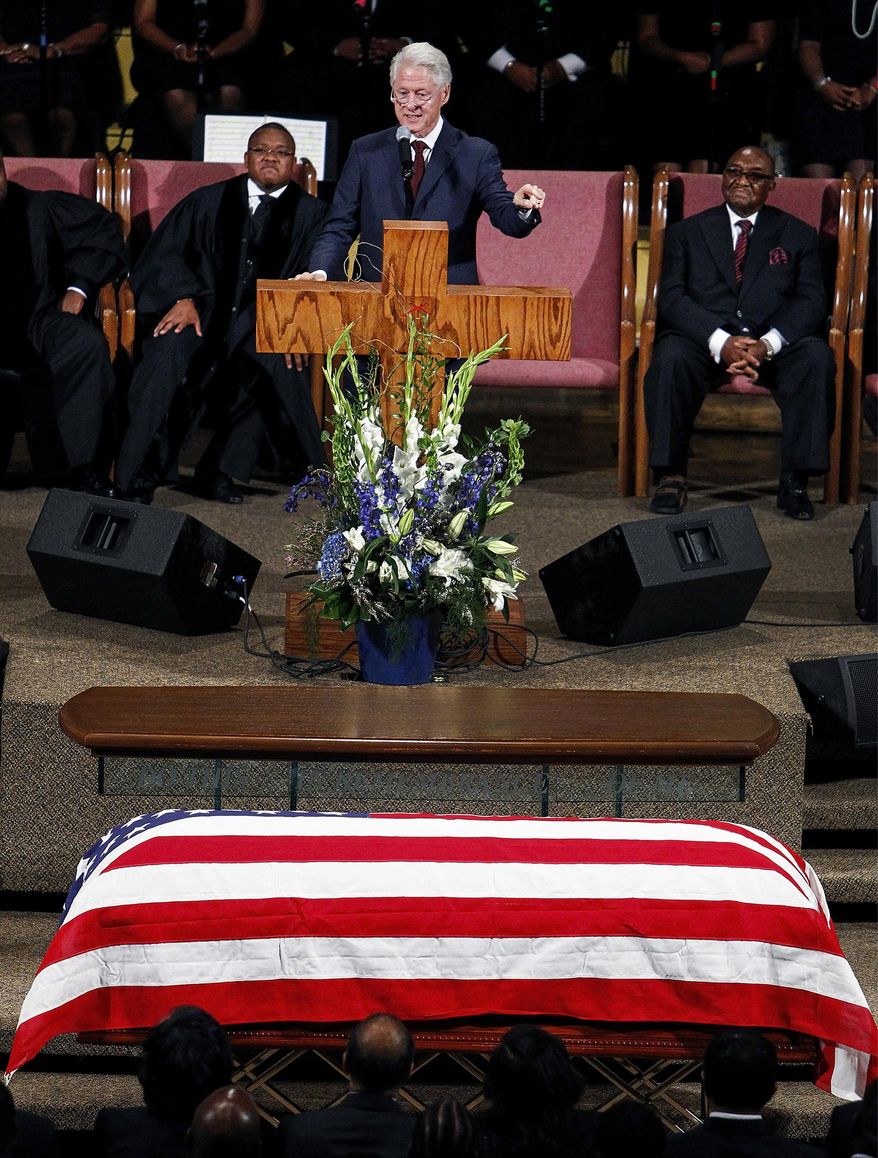 Former President Bill Clinton gives a eulogy during the funeral for Judge D'Army Bailey at the Mississippi Boulevard Christian Church, Saturday, July 18, 2015 in Memphis, Tenn. Bailey helped preserve the Memphis hotel where civil rights leader Martin Luther King Jr. was assassinated and turn it into the National Civil Rights Museum. (Mark Weber/The Commercial Appeal via AP) MANDATORY CREDIT