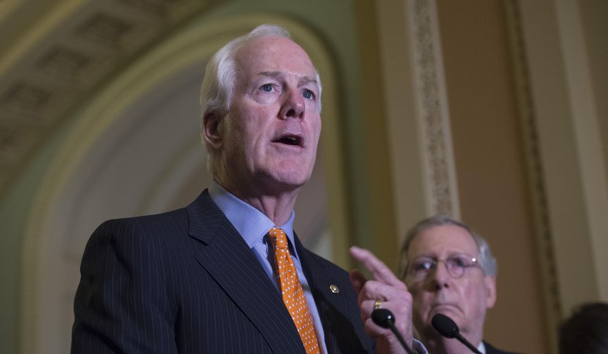 Senate Majority Whip John Cornyn of Texas, speaks next to Senate Majority Leader Mitch McConnell of Ky. during a news conference on Capitol Hill in Washington, in this June 9, 2015, file photo. (AP Photo/Molly Riley, File)