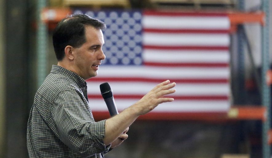 Republican presidential candidate Wisconsin Gov. Scott Walker addresses a crowd at Giese Manufacturing, Sunday, July 19, 2015, in Dubuque, Iowa. (Mike Burley/Telegraph Herald via AP)