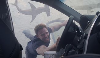 Ian Ziering portrays Fin Shepard in &quot;Sharknado 3: Oh Hell No,&quot; premiering Wednesday at 9 p.m. EDT on Syfy.  (Syfy via AP)