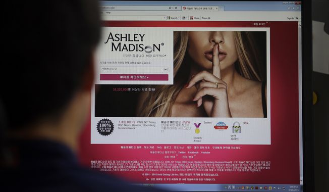 The Ashley Madison cheating website is shown on a computer screen in Seoul on June 10, 2015. (Associated Press) **FILE**