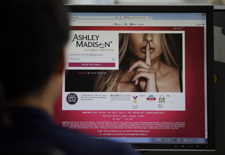 The Ashley Madison cheating website is shown on a computer screen in Seoul on June 10, 2015. (Associated Press) **FILE**