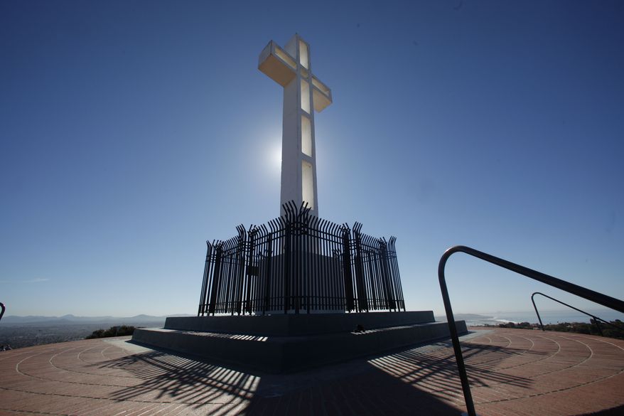 The Mount Soledad Memorial Association, the veterans group that maintains the memorial, announced Monday that it has purchased the half-acre of federal land on which the 29-foot Latin cross stands from the Defense Department for $1.4 million. (Associated Press)