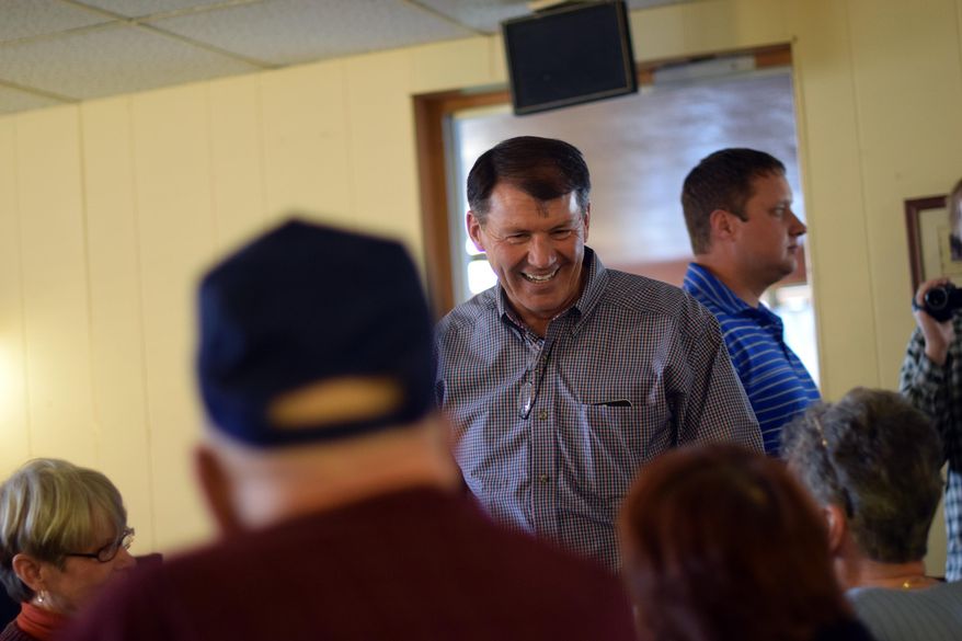 In this Nov. 2, 2014, file photo, then-U.S. Senate candidate Mike Rounds greets patrons of the Belle Inn Restaurant in Belle Fourche, S.D. Rounds won the election and has now started fundraising through the Peter Norbeck Leadership PAC. Those committees are often used to raise a politician’s profile and help get like-minded candidates elected. (AP Photo/Kevin Burbach, file)