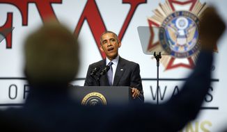 A veteran stands as President Barack Obama addresses the Veterans of Foreign Wars National Convention at the David Lawrence Convention Center in Pittsburgh Tuesday, July 21, 2015. (AP Photo/Gene J. Puskar)