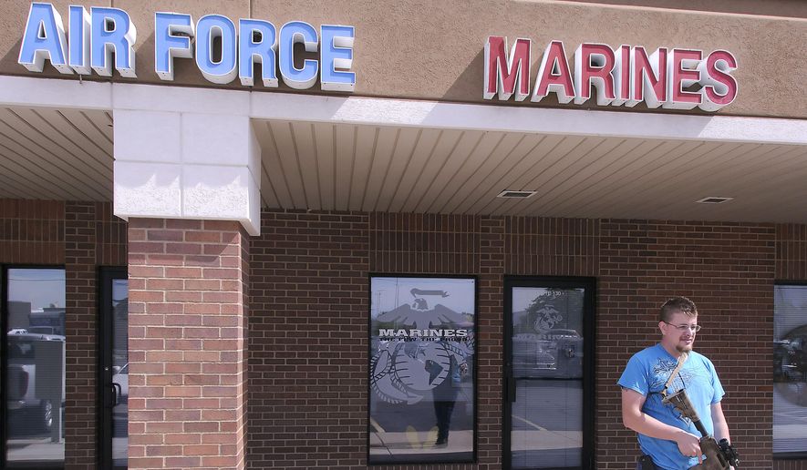 Joshua B. Van Natter stands outside a military recruiting center on Tuesday, July 21, 2015, in Logan, Utah. Gun-toting citizens are showing up at military recruiting centers around the country, saying they plan to protect recruiters following last week&#39;s killing of four Marines and a sailor in Chattanooga, Tenn. (Eli Lucero/Herald Journal via AP)