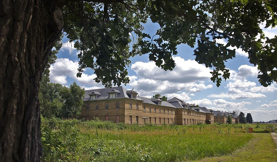 The enlisted men’s barracks are seen at Fort Snelling State Park, Wednesday, July 22, 2015, in St. Paul, Minn. State officials announced plans to rehabilitate the historic Fort Snelling Upper post into affordable housing units. (Jim Gehrz/Star Tribune via AP)