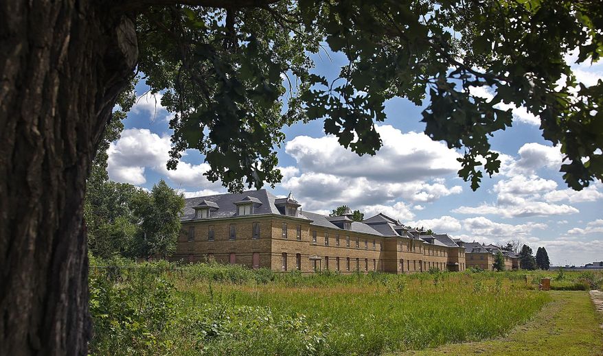 The enlisted men’s barracks are seen at Fort Snelling State Park, Wednesday, July 22, 2015, in St. Paul, Minn. State officials announced plans to rehabilitate the historic Fort Snelling Upper post into affordable housing units. (Jim Gehrz/Star Tribune via AP)