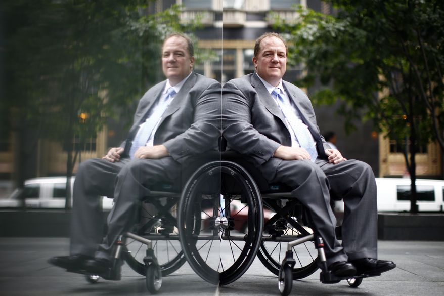 ADVANCE FOR USE SUNDAY, JULY 26, 2014 AND THEREAFTER - Fred Maahs, poses for a photograph in Philadelphia on Monday, July 13, 2015. The Comcast executive has become a prominent disability-rights activist since being paralyzed from the chest down in a diving accident 35 years ago. Sunday, July 26, 2015 marks the 25th anniversary of the Americans With Disabilities Act (ADA). (AP Photo/Matt Rourke)