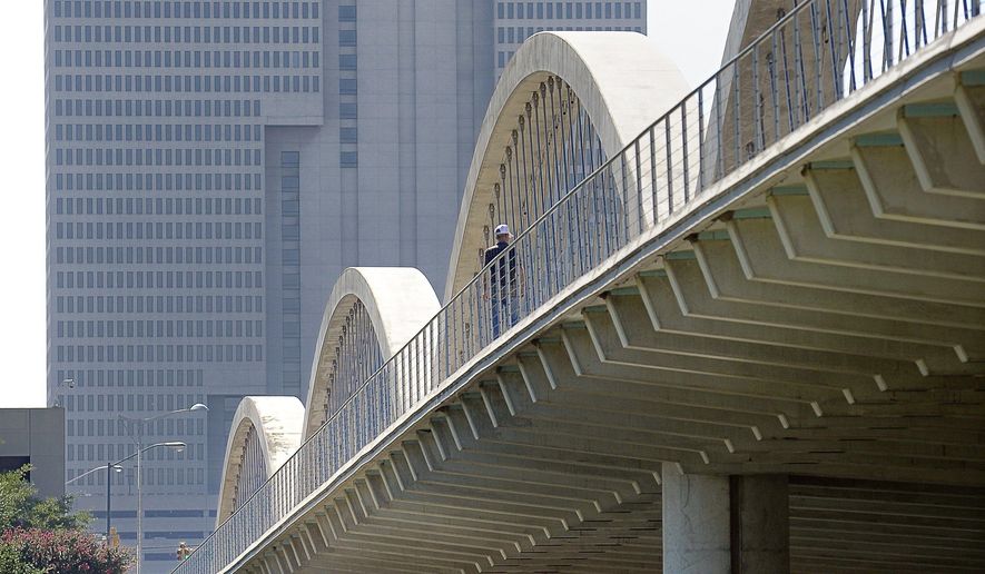 West Seventh Street bridge in Fort Worth, Texas, Monday, July 13, 2015. Venus, Texas, experienced a 4.0 earthquake in May, 2015, and the next morning the Texas Department of Transportation sent inspectors out to look at bridges and make sure there was no damage. All bridges built in the Fort Worth area since the 1990s have been designed with standards for areas with a low risk of earthquakes. (Max Faulkner/Fort Worth Star-Telegram via AP) MANDATORY CREDIT MAGS OUT (FORT WORTH WEEKLY, 360 WEST); INTERNET OUT