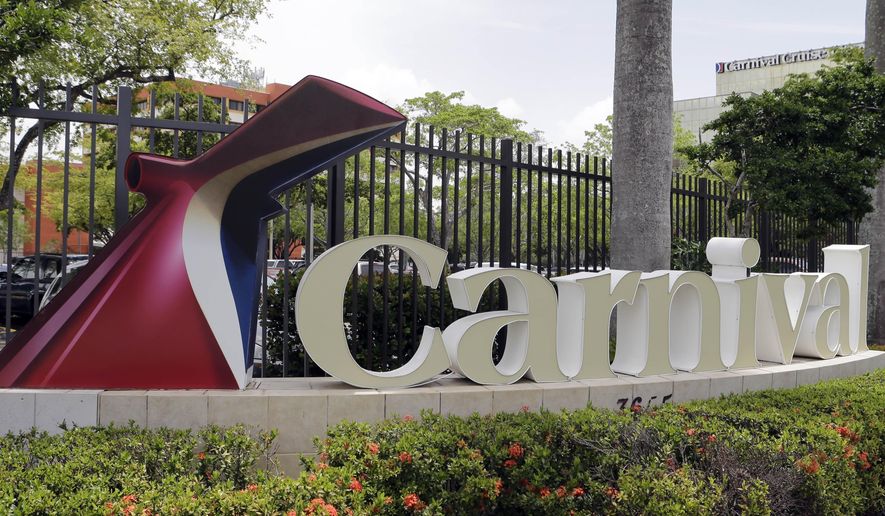 This July 7, 2015 photo shows signage outside the Carnival Cruise Lines offices, in Miami. Carnival, the world&#39;s largest cruise provider, and the U.S. Justice Department on Thursday, July 23, 2015 announced a settlement regarding accessibility access for people with disabilities on 62 ships in the Carnival, Holland America and Princess Cruises brands. (AP Photo/Alan Diaz)