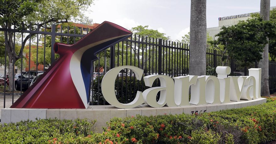 This July 7, 2015 photo shows signage outside the Carnival Cruise Lines offices, in Miami. Carnival, the world&#39;s largest cruise provider, and the U.S. Justice Department on Thursday, July 23, 2015 announced a settlement regarding accessibility access for people with disabilities on 62 ships in the Carnival, Holland America and Princess Cruises brands. (AP Photo/Alan Diaz)