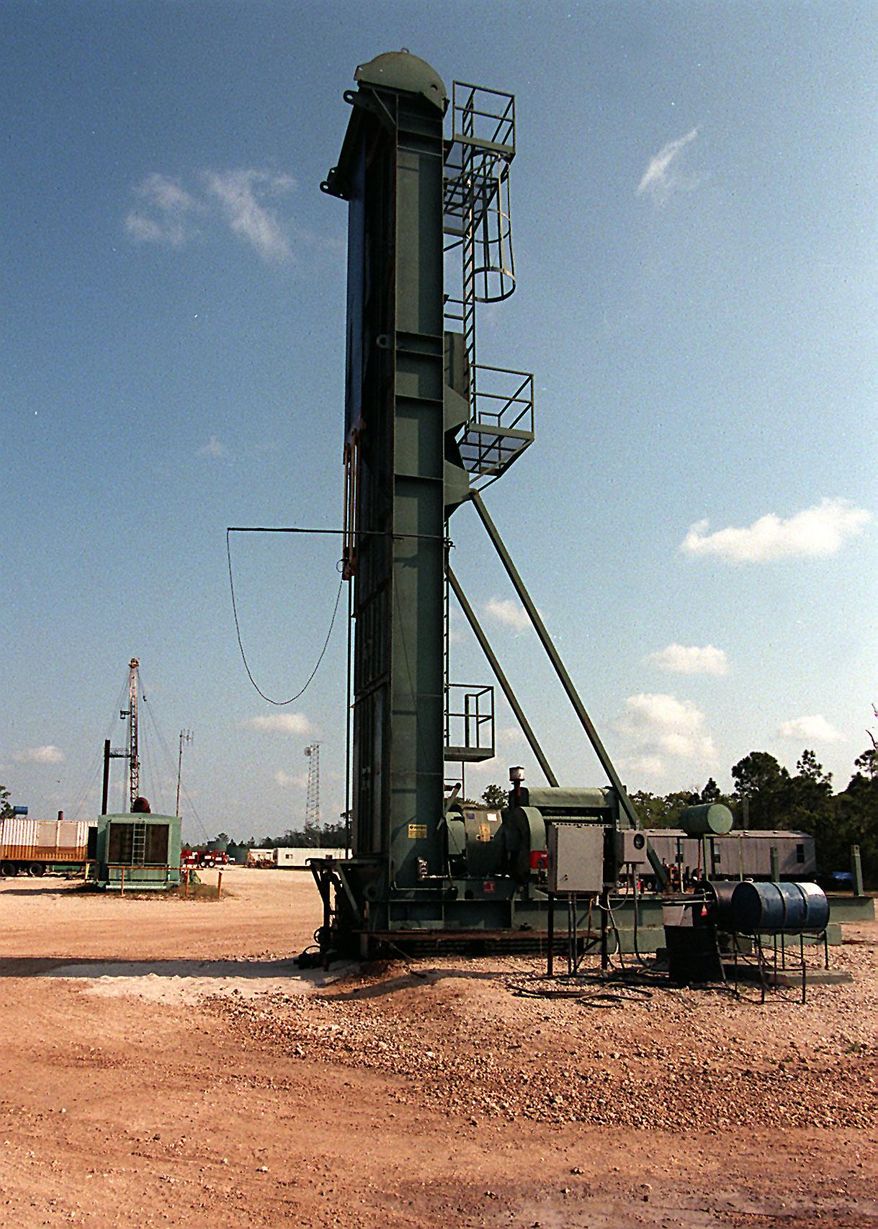 In this April 6, 1999 photo shows an oil pump at Pad 2 in the Racoon Point Oil Field in Big Cypress National Preserve in the Florida Everglades. Renewed hunts for oil in sensitive Florida ecosystems have environmental groups raising questions about the state's regulation of the oil and gas industry. (Tim Chapman/The Miami Herald via AP)